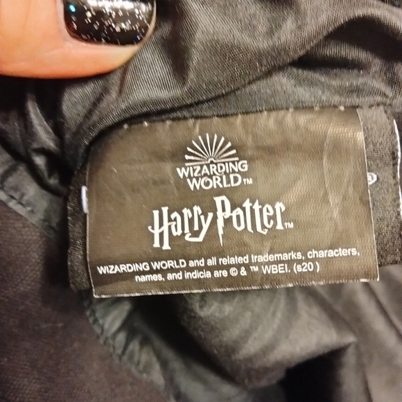 This Harry Potter Hufflepuff Varsity Backpack in black, tan, and gold is a must- - Picture 6 of 7